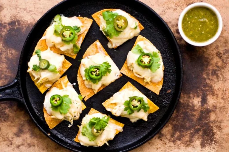 Sour cream chicken nachos with poblano salsa verde